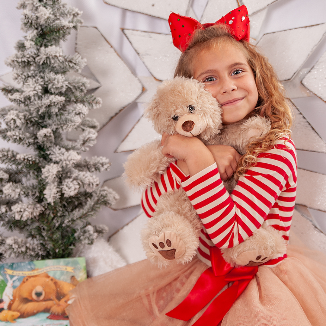 Girl hugs her Book and Bear Teddy Bear