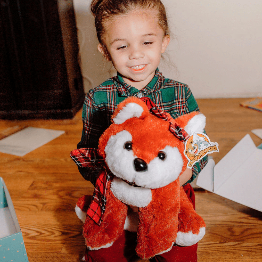 Boy hugs the fox he crafted