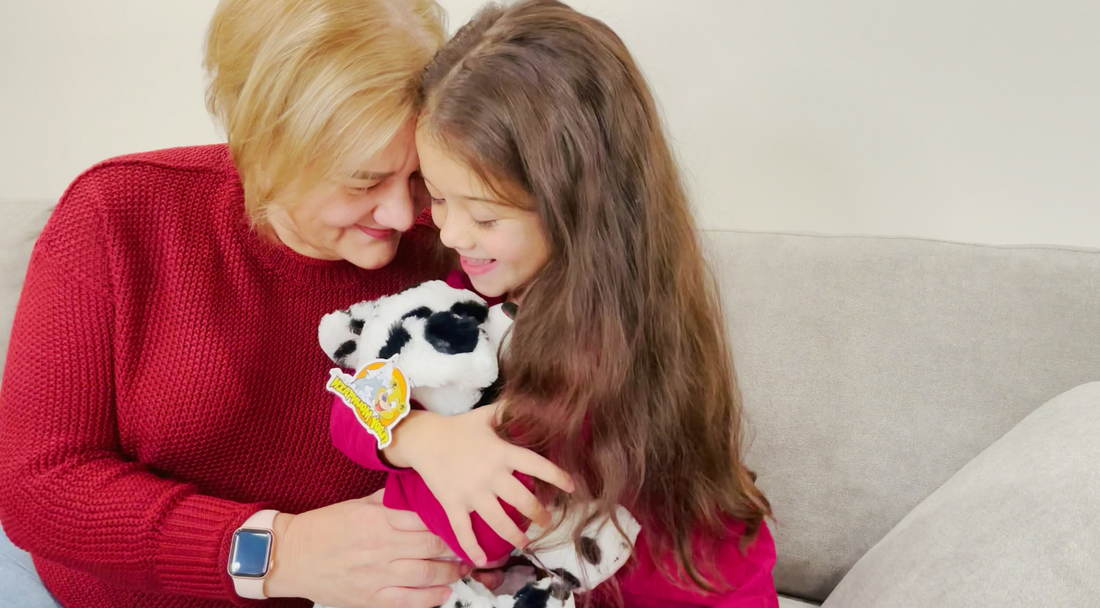 Grandma & Granddaughter hugging stuffed dalmatian