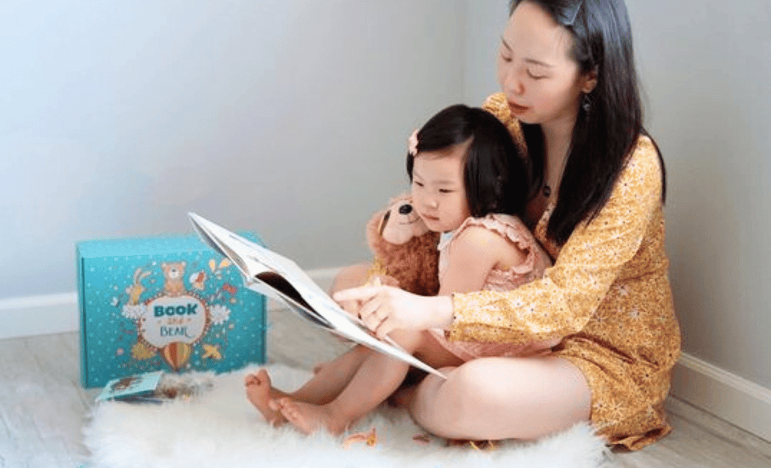 Mom and daughters reading together