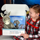 Girl holds open donkey Book and Bear Box